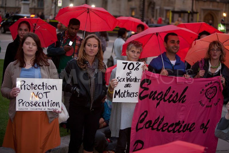 Sex workers demonstrate for rights to work without fear of arrest. Protesters marched with red umbrellas. London, UK, 13th October 2011 1511