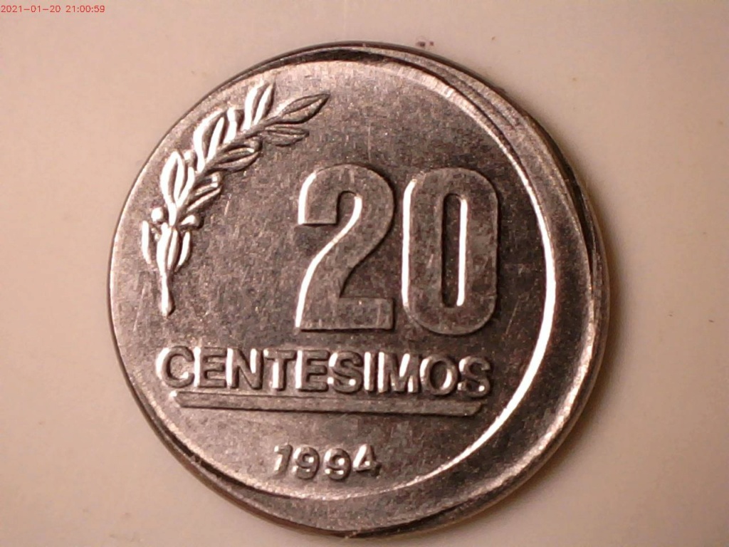 moneda de Uruguay de 20 centesimos acunada fuera de centro 204910