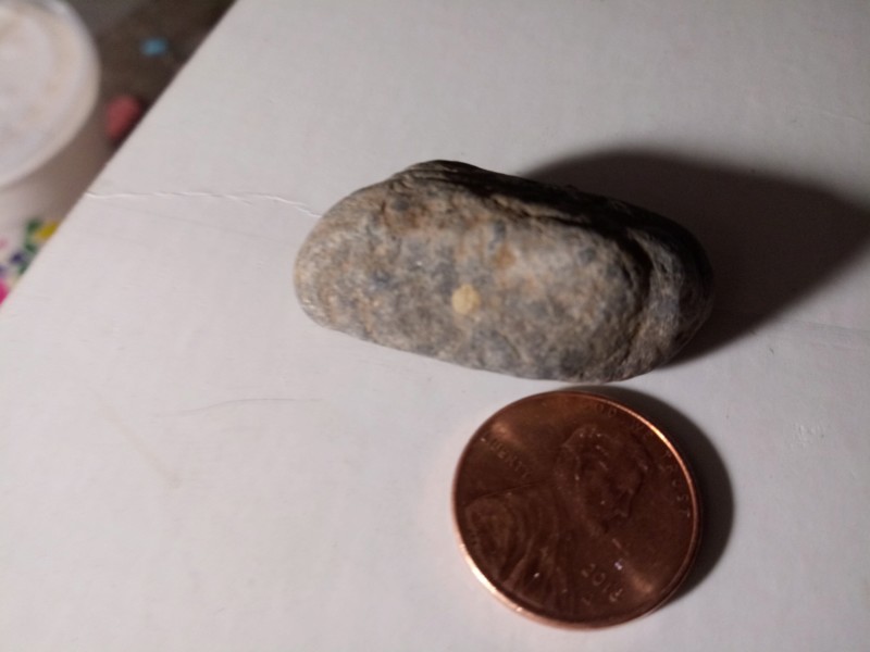 Mesa Arizona tiny figure Stone layers of sediment I just ran some water over it I didn't scrub it 20191159