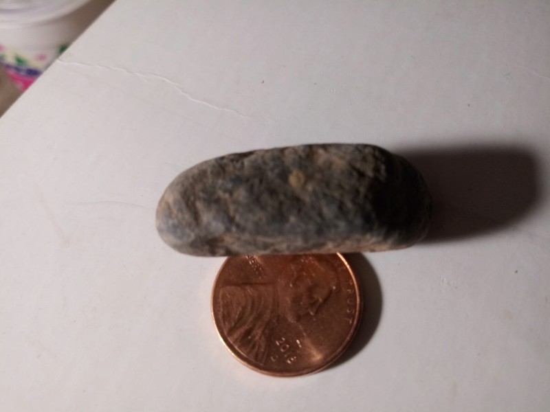 Mesa Arizona tiny figure Stone layers of sediment I just ran some water over it I didn't scrub it 20191160
