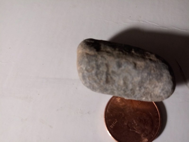 Mesa Arizona tiny figure Stone layers of sediment I just ran some water over it I didn't scrub it 20191161