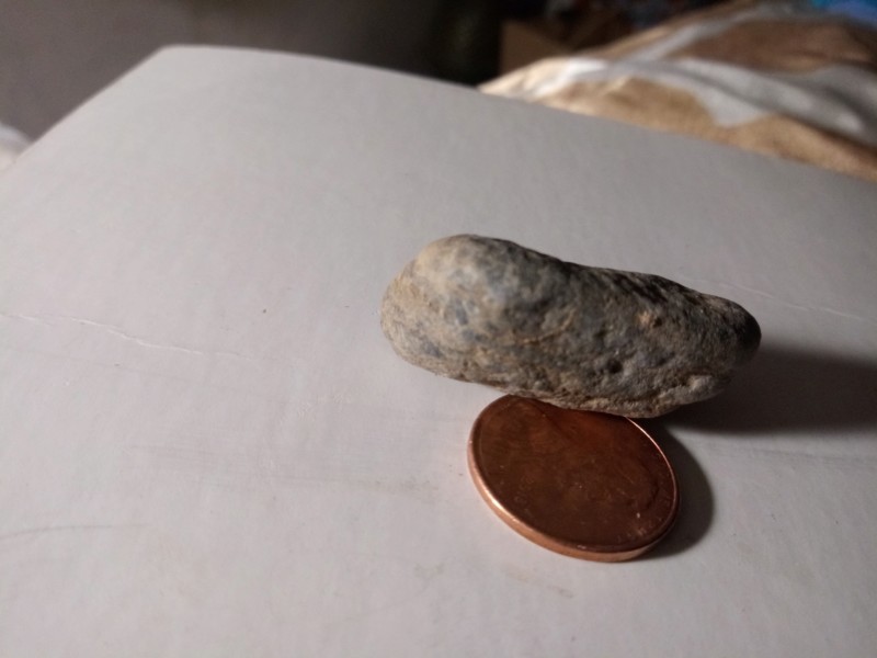 Mesa Arizona tiny figure Stone layers of sediment I just ran some water over it I didn't scrub it 20191162