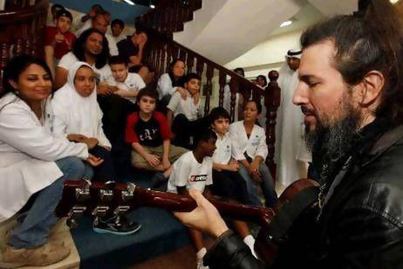 2012.10.04 - The National - Guns N' Roses Rocker Charms Children At Dubai Autism Centre (Bumblefoot) 2012_b10