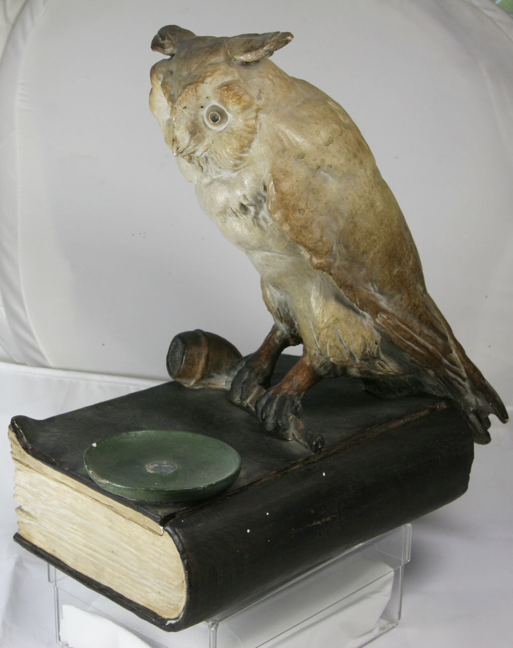 Book, smoking pipe and owl?? K110